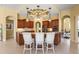 Gourmet kitchen with granite countertops, custom cabinets, and a center island with seating at 6143 9Th Avenue Ne Cir, Bradenton, FL 34212
