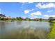 Scenic lake view surrounded by manicured lawns and beautiful waterfront homes at 6143 9Th Avenue Ne Cir, Bradenton, FL 34212
