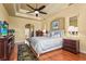 Spacious bedroom with hardwood floors and a tray ceiling with recessed lighting at 6143 9Th Avenue Ne Cir, Bradenton, FL 34212
