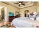 This main bedroom offers a trey ceiling, wood floors and a sliding glass door at 6143 9Th Avenue Ne Cir, Bradenton, FL 34212