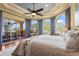 Primary bedroom showcasing a view of the lanai and outdoor fireplace at 6143 9Th Avenue Ne Cir, Bradenton, FL 34212