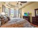 This main bedroom is well lit with bay windows and has an attached bath at 6143 9Th Avenue Ne Cir, Bradenton, FL 34212