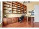 Bright home office with extensive built-in bookshelves, and ample natural light at 6143 9Th Avenue Ne Cir, Bradenton, FL 34212