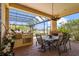 Enclosed patio with grill, dining, seating, and fireplace for outdoor living at 6143 9Th Avenue Ne Cir, Bradenton, FL 34212