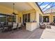 Covered patio with full dining area and additional seating at the outdoor bar at 6143 9Th Avenue Ne Cir, Bradenton, FL 34212