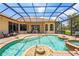 Stunning pool with water features and lake views that offers relaxation at 6143 9Th Avenue Ne Cir, Bradenton, FL 34212
