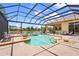 Enjoy outdoor living with this screened in pool and lovely lake views at 6143 9Th Avenue Ne Cir, Bradenton, FL 34212