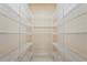 Spacious walk-in closet with ample shelving and plenty of storage at 6143 9Th Avenue Ne Cir, Bradenton, FL 34212