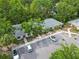 Overhead shot showing the layout of the property with parking and mature trees, creating a tranquil setting at 642 N Jefferson Ave # 13, Sarasota, FL 34237