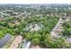 High-angle view showcasing the property, nearby ponds, and mature trees within the neighborhood at 642 N Jefferson Ave # 13, Sarasota, FL 34237