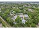 High-altitude view illustrating the position of the property and its extensive tree coverage within the community at 642 N Jefferson Ave # 13, Sarasota, FL 34237