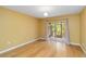 Bedroom featuring hardwood floors, neutral paint, sliding glass door, and light fixture at 642 N Jefferson Ave # 13, Sarasota, FL 34237
