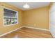 Bright bedroom with hardwood floors, window, and a closet providing plenty of space at 642 N Jefferson Ave # 13, Sarasota, FL 34237