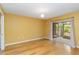 Bright bedroom with hardwood floors and sliding glass doors leading to a lanai at 642 N Jefferson Ave # 13, Sarasota, FL 34237
