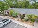 Up close exterior of condo with updated landscaping and assigned parking at 642 N Jefferson Ave # 13, Sarasota, FL 34237