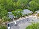 Exterior view of condo with mature landscaping, parking, and a lovely community feel at 642 N Jefferson Ave # 13, Sarasota, FL 34237