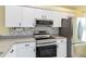 Kitchen boasts sleek stainless steel appliances and modern finishes at 642 N Jefferson Ave # 13, Sarasota, FL 34237