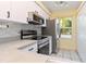 Kitchen features white cabinets, stainless steel appliances, and a window with natural light at 642 N Jefferson Ave # 13, Sarasota, FL 34237