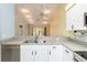 Kitchen with a breakfast bar overlooking the living area and large windows at 642 N Jefferson Ave # 13, Sarasota, FL 34237