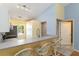 Kitchen with breakfast bar and abundant natural light at 642 N Jefferson Ave # 13, Sarasota, FL 34237