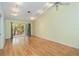 Bright living room features hardwood floors and sliding glass doors to the patio at 642 N Jefferson Ave # 13, Sarasota, FL 34237