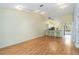 Bright and spacious living area with hardwood floors, bar seating, and vaulted ceilings at 642 N Jefferson Ave # 13, Sarasota, FL 34237