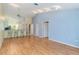 Spacious living room boasts vaulted ceilings and hardwood floors, flooded with natural light at 642 N Jefferson Ave # 13, Sarasota, FL 34237