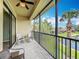 Cozy balcony area shows seating and pretty view of a pond at 7346 Skybird Rd # 417, Bradenton, FL 34209