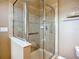 Modern bathroom featuring a glass-enclosed shower with tiled walls at 7346 Skybird Rd # 417, Bradenton, FL 34209