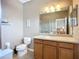 Bathroom featuring a vanity with a large mirror and a tiled shower at 7346 Skybird Rd # 417, Bradenton, FL 34209