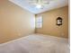 Bedroom with neutral walls, carpet, shutters on the window, and a ceiling fan at 7346 Skybird Rd # 417, Bradenton, FL 34209
