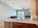 Kitchen area featuring light countertops that looks into the living area beyond at 7346 Skybird Rd # 417, Bradenton, FL 34209