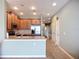 Well-lit kitchen with wood cabinets, stainless steel appliances, light countertops, and decorative backsplash at 7346 Skybird Rd # 417, Bradenton, FL 34209
