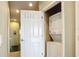 Hallway laundry closet featuring a stacked washer and dryer for added convenience at 7346 Skybird Rd # 417, Bradenton, FL 34209