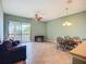 Open-concept living area with sliding doors to the patio with lovely lake views at 7346 Skybird Rd # 417, Bradenton, FL 34209