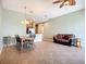 Spacious living area with tiled floor and adjacent kitchen with modern stainless appliances at 7346 Skybird Rd # 417, Bradenton, FL 34209