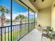 Relax on the screened patio and enjoy serene lake views and lush tropical landscaping at 7346 Skybird Rd # 417, Bradenton, FL 34209