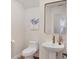 Charming powder room with a pedestal sink, modern fixtures, and stylish decor at 7551 Calle Facil, Sarasota, FL 34238