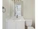 Bathroom with a marble countertop vanity and a modern, neutral style at 7551 Calle Facil, Sarasota, FL 34238