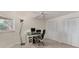 Bright bedroom featuring a computer desk and ceiling fan, perfect for a home office setup at 7551 Calle Facil, Sarasota, FL 34238