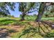 Expansive green space with mature trees provides a scenic and serene setting at 7551 Calle Facil, Sarasota, FL 34238