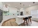 Bright, renovated kitchen with white cabinets, a center island, and modern appliances at 7551 Calle Facil, Sarasota, FL 34238