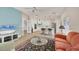 Bright and airy living space showcasing an open floor plan with a view of the modern kitchen at 7551 Calle Facil, Sarasota, FL 34238