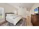 Comfortable main bedroom with an ensuite bathroom and a view of the hallway at 7551 Calle Facil, Sarasota, FL 34238