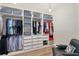 Organized walk-in closet with custom shelving, drawers, and hanging racks at 7551 Calle Facil, Sarasota, FL 34238