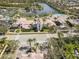 This stunning aerial view captures the community center and serene lake at 7641 Quinto Dr, Sarasota, FL 34238
