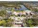This stunning aerial view captures the community center and lake at 7641 Quinto Dr, Sarasota, FL 34238