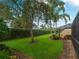The home's backyard offers a serene view with meticulously maintained landscaping at 7641 Quinto Dr, Sarasota, FL 34238