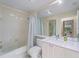 Bathroom featuring a shower with a curtain and a vanity with white countertops at 7641 Quinto Dr, Sarasota, FL 34238