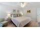 Spacious bedroom featuring wood-look tile floors and a ceiling fan at 7641 Quinto Dr, Sarasota, FL 34238